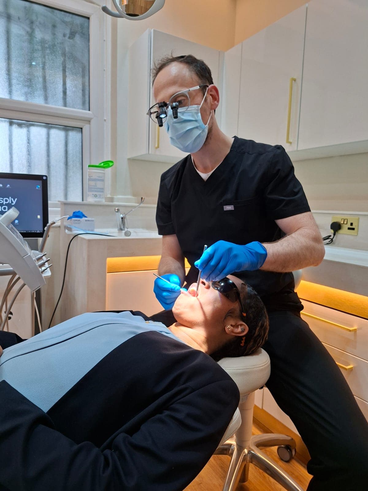 Dr. Haffner performing a check-up on a patient